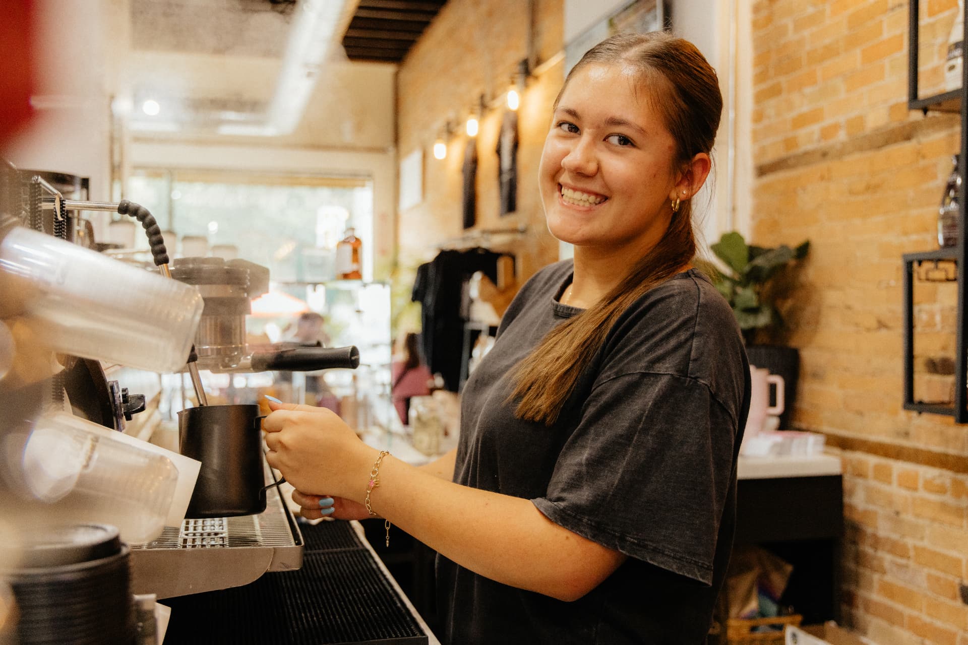 Barista steaming milk